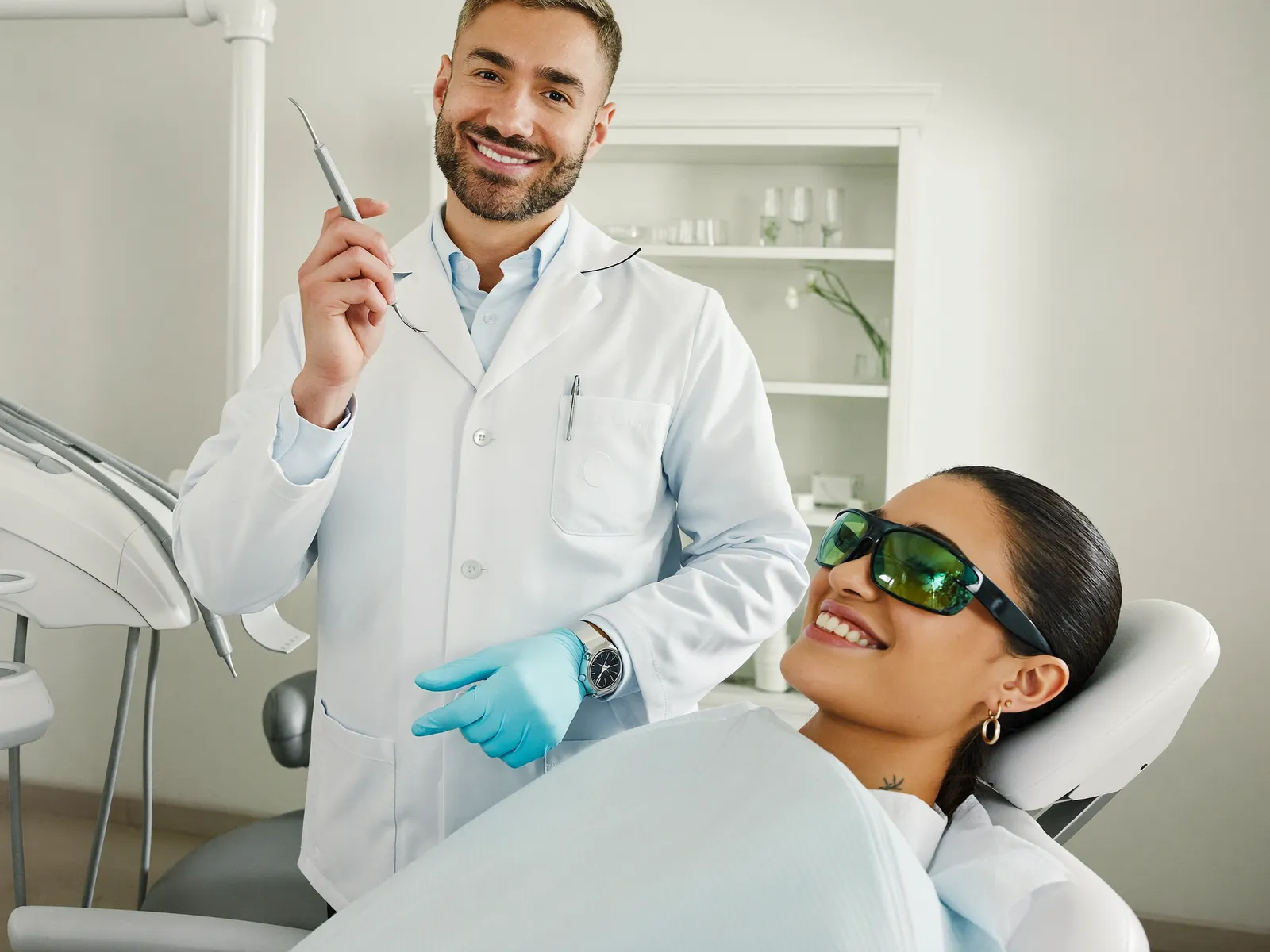 A dentist reassuring a calm patient before treatment